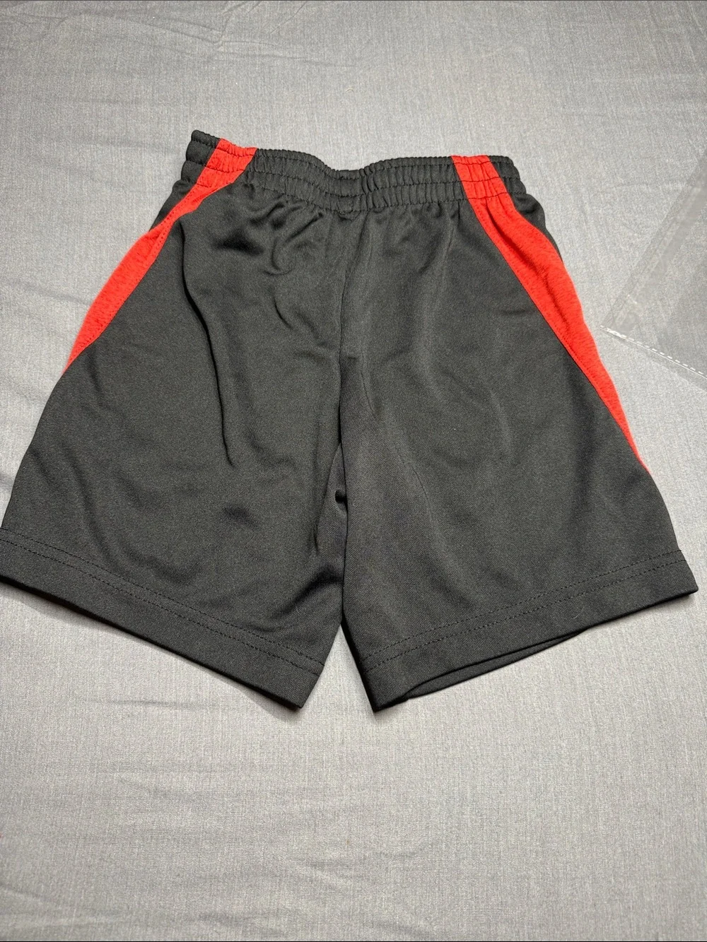 Nike Black Kids Shorts with Red Accent and White Swoosh